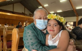 Valeti Finau and her granddaughter Taufa Sialetonga held each other tight at Lotofale’ia Methodist Church in Mangere, as they remembered the pain of the 2022 disaster. “Ofa Atu” - miss Sialetonga said.