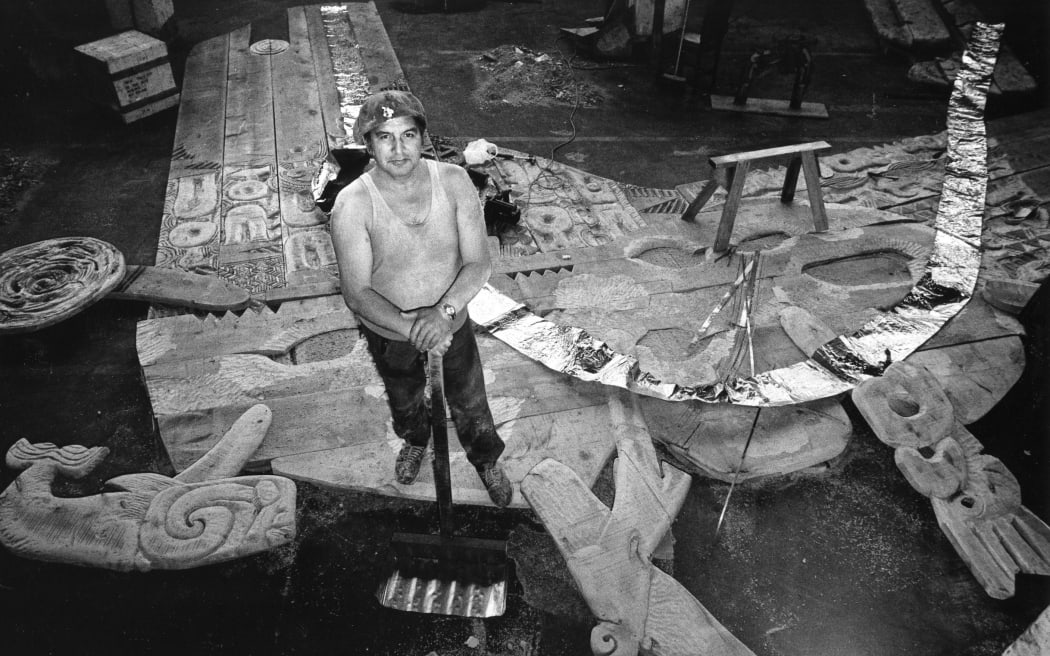 Maori artist Selwyn Muru in his workshop with the Waharoa sculpture. Muru is a sculptor, film-maker, composer, and broadcaster.