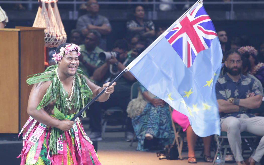 The Tuvalu flag bearer at FestPAC2024