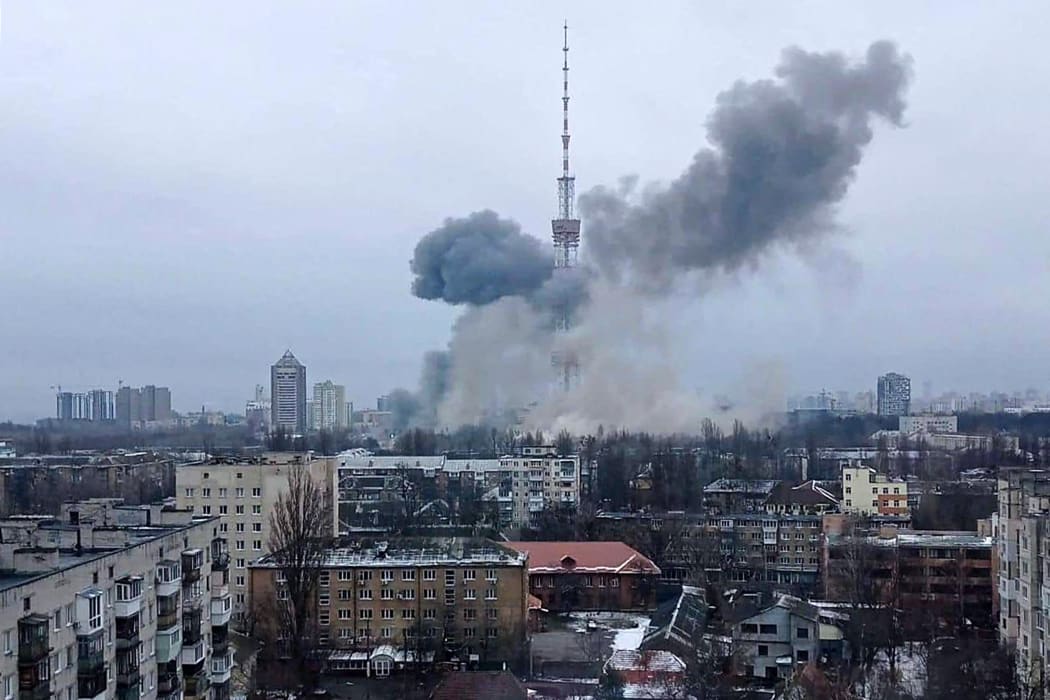 This handout picture released on the Facebook page of the Ukrainian Interior ministry  on March 1, 2022 show the smoke after a missile attack targeting the Ukrainian capitals television centre in Kyiv.