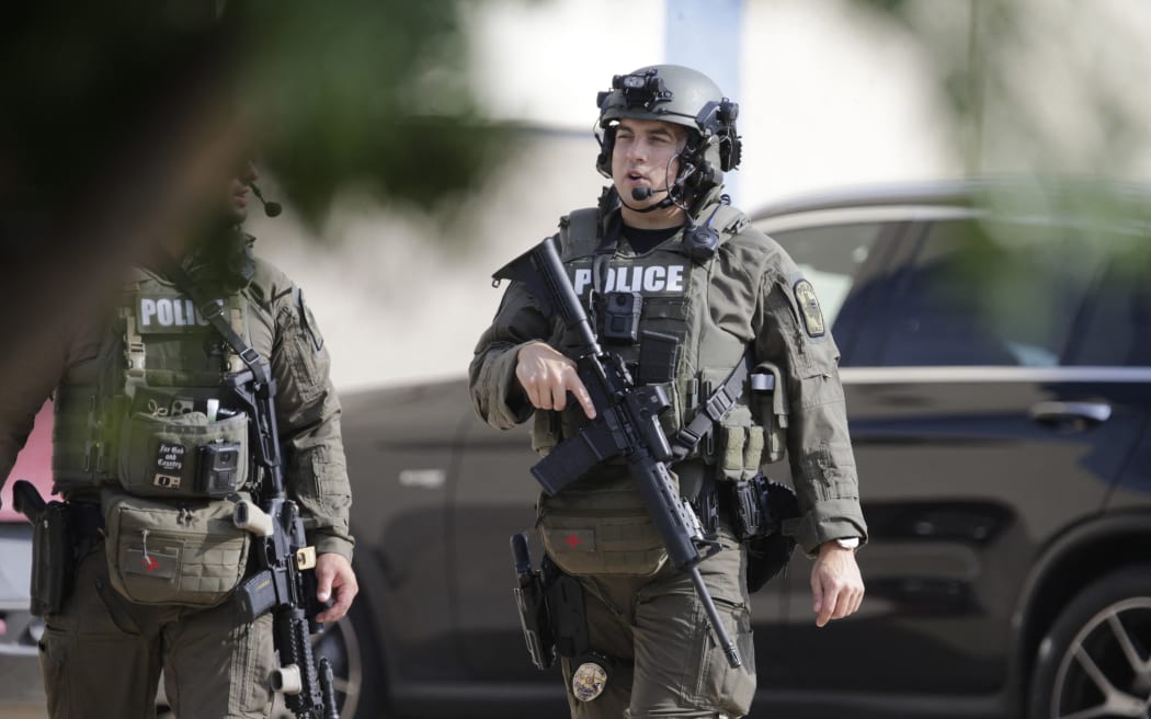 ALLEN, TEXAS - MAY 6: A member for the Allen SWAT team returns to the parking lot near the scene of a shooting at Allen Premium Outlets on May 6, 2023 in Allen, Texas. According to reports, a shooter opened fire at the outlet mall, injuring nine people who were taken to local hospitals. The police have confirmed there were fatalities but have not specified how many. The unidentified shooter was neutralized by an Allen Police officer responding to an unrelated call.   Stewart F. House/Getty Images/AFP (Photo by Stewart F. House / GETTY IMAGES NORTH AMERICA / Getty Images via AFP)