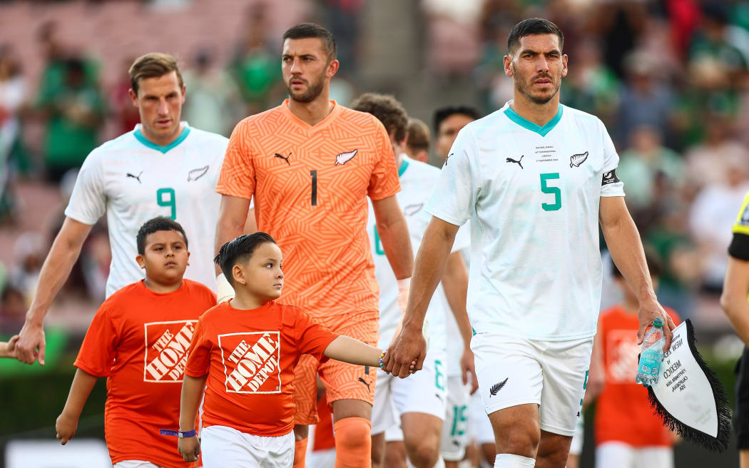 New Zealand captain Michael Boxall leads the All Whites team out against Mexico in 2024.