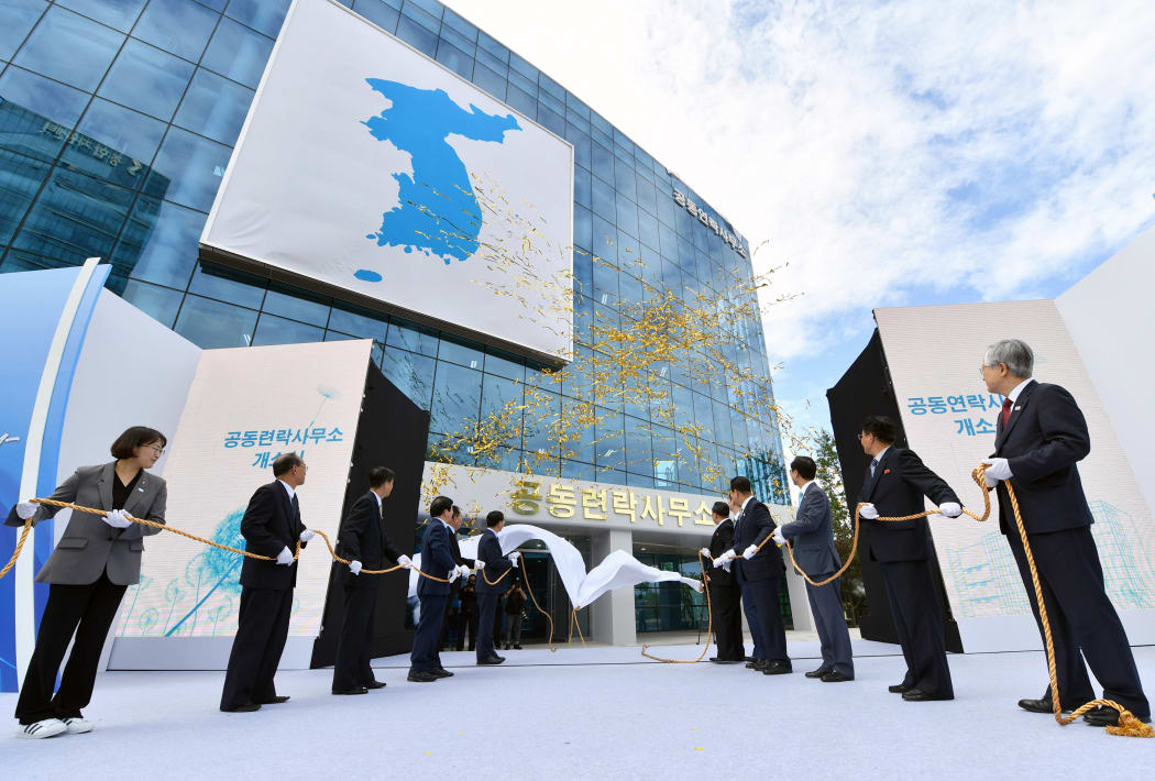 South and North Korean officials attend an opening ceremony of a joint liaison office in Kaesong on September 14, 2018.
