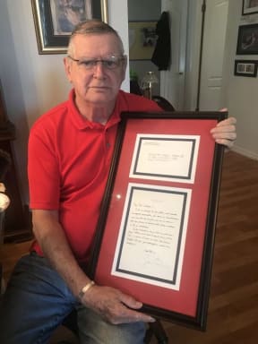Thomas Meehan, father of Colleen Barkow who was killed in the World Trade Centre attack, with his letter from President Obama.