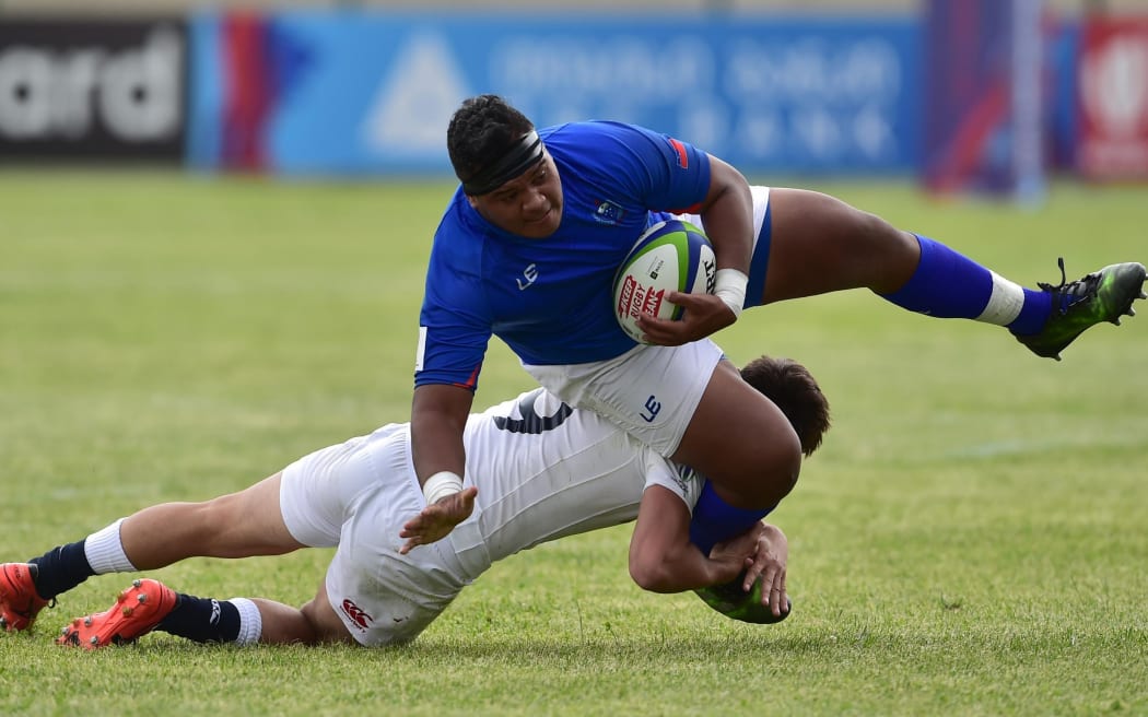 Samoa hooker Noel Sanft is tackled during their opening round defeat by England.