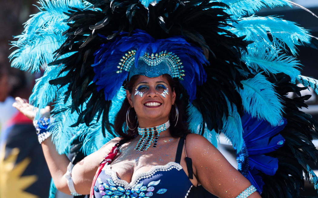 Performers in colourful costumes dance to the rhythms of the mobile sound systems along the streets of West London during the grand finale (Monday Parade) of the Notting Hill Carnival on 26 August, 2019 in London, England.