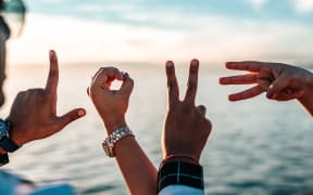 four hands spell L-O-V-E love
