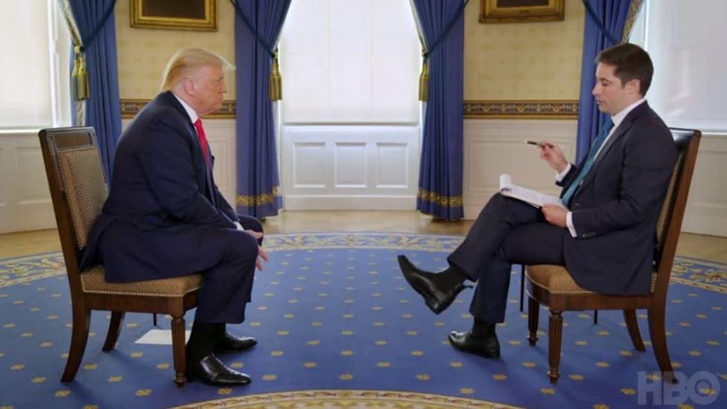 Axios National Political Correspondent Jonathan Swan speaking with US President Donald Trump.