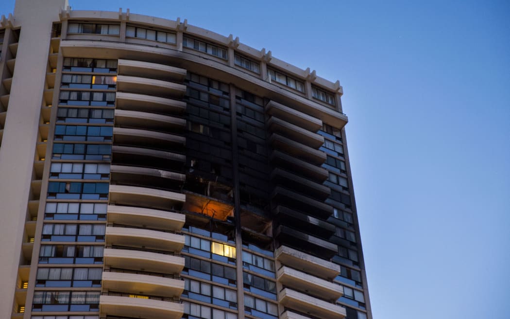 The charred exterior of the Marco Polo Building in Honolulu is pictured after a fire broke out on the upper floors