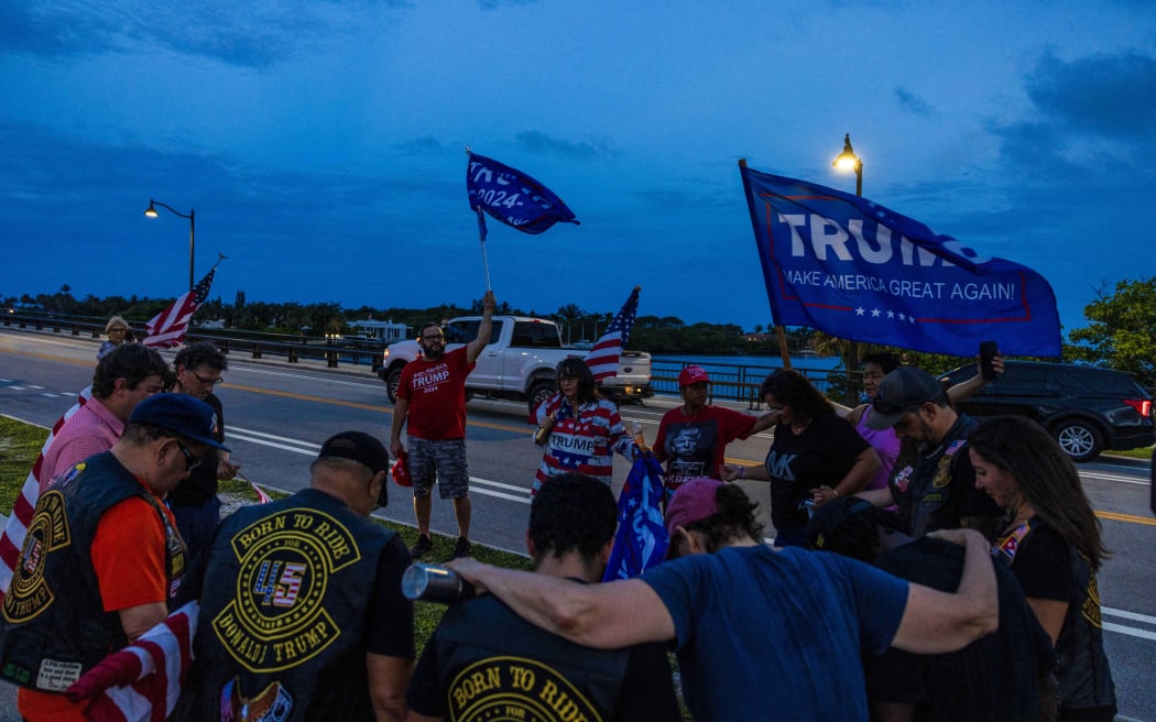 Supporters of former Donald Trump gather outside his Mar-a-Lago property on Palm Beach, Florida, following the events at the Butler rally, on 13 July, 2024.