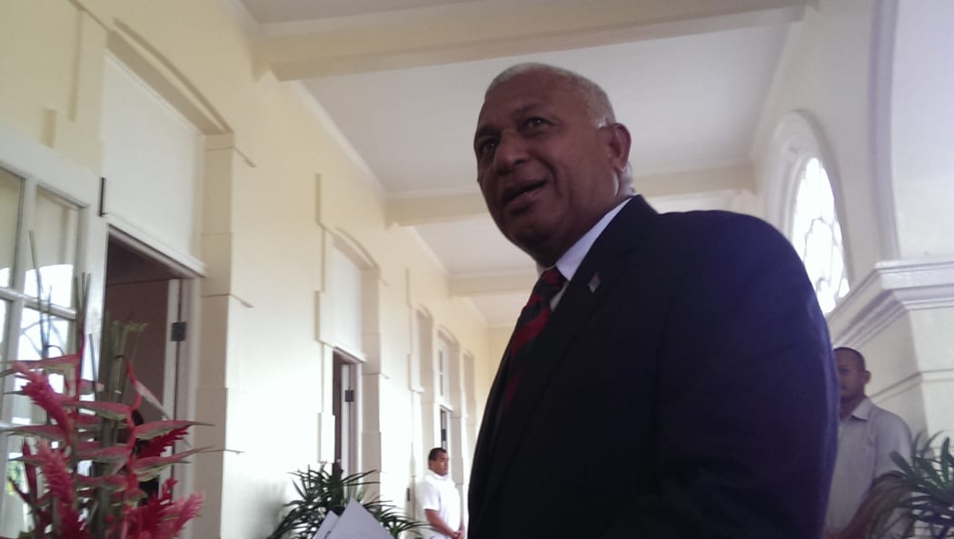 Frank Bainimarama arrives for his swearing in ceremony at Government House in Suva after his landslide victory at the 2014 election