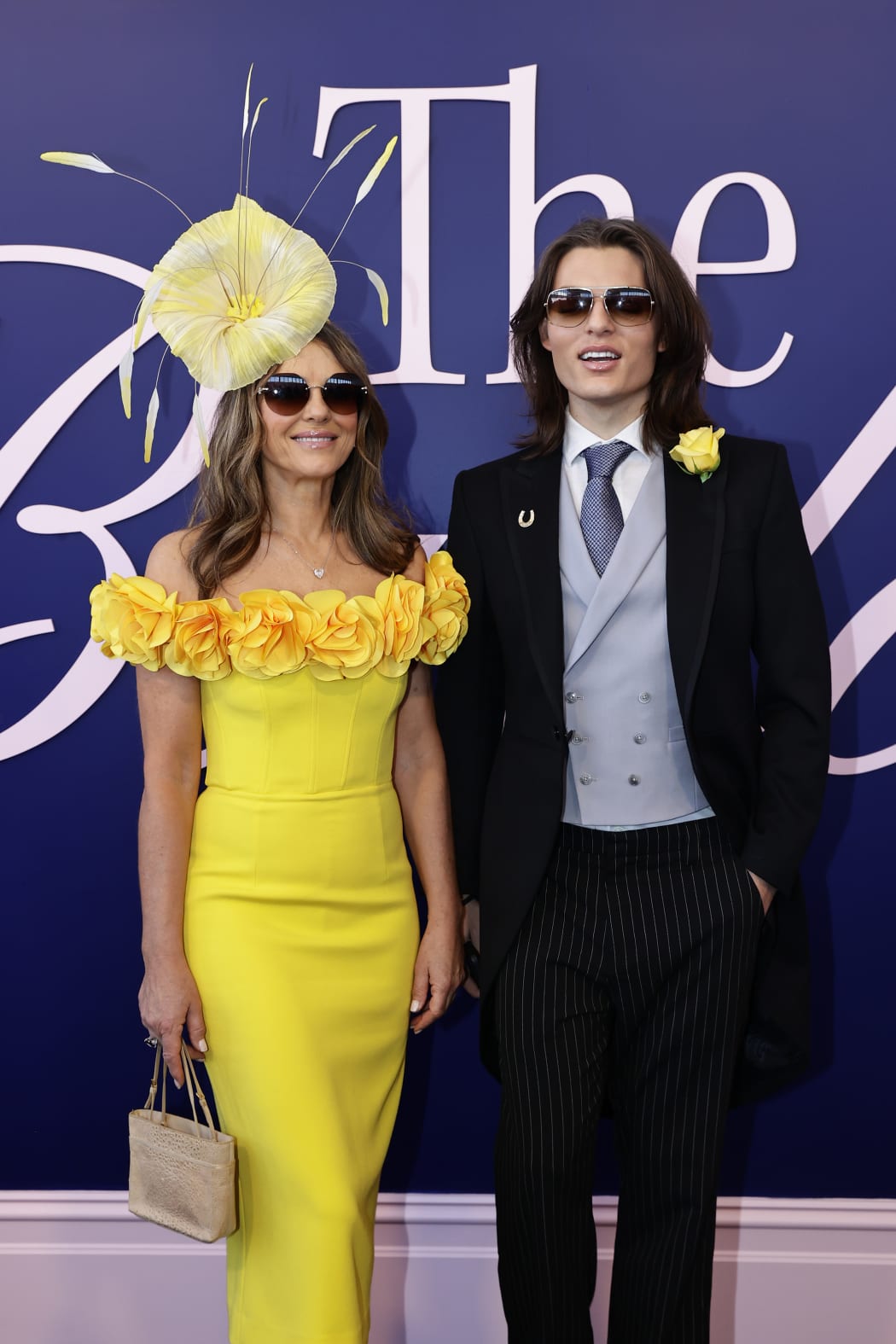 Elizabeth Hurley and Damian Hurley pose for a photo during 2024 Melbourne Cup Day at Flemington Racecourse on November 05, 2024 in Melbourne, Australia.
