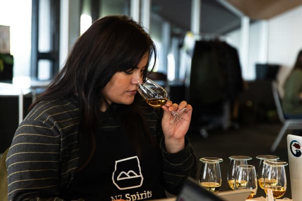 Aroha Jakicevich judging whiskey