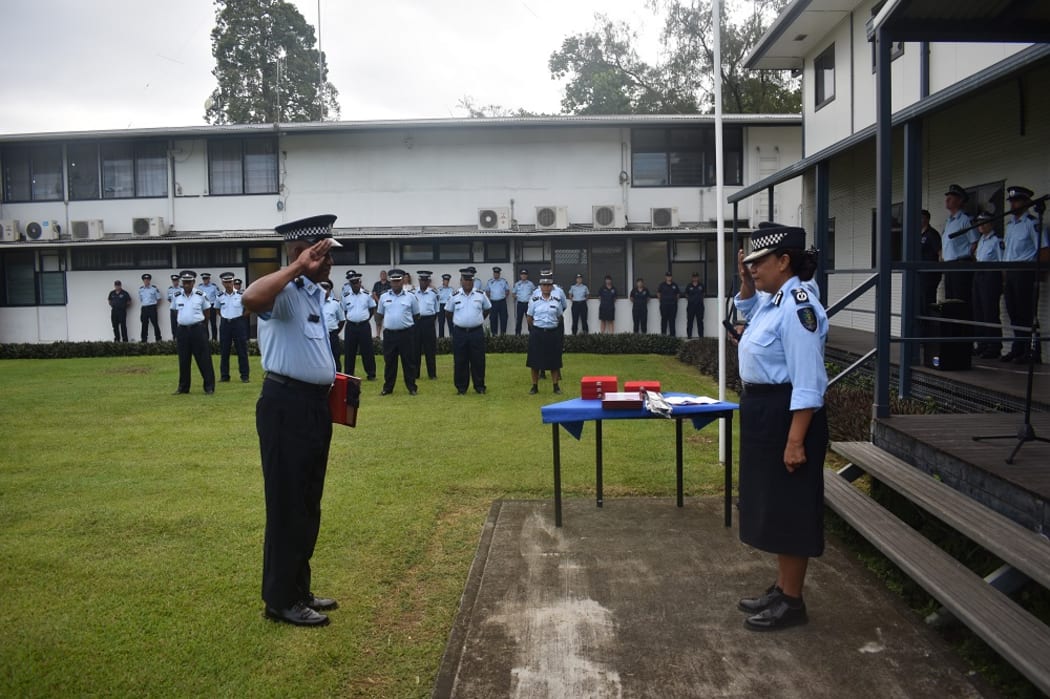 Retiring Inspector Surimalefo salutes Supervising Commissioner Matanga