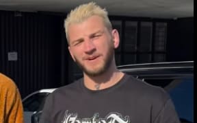 Israel Adesanya and Dan hooker announcing the 32 women backyard battle royal.