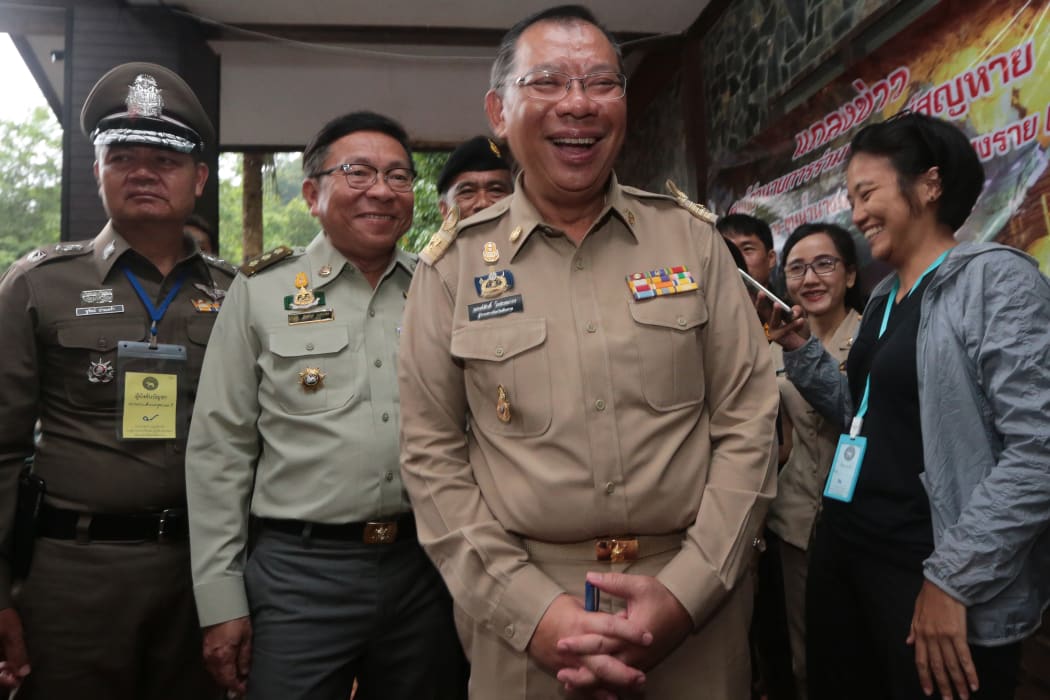 Chiang Rai governor Narongsak Osotthanakorn, centre, beams as he attends a press briefing on the mission to rescue the boys trapped in Tham Luang cave in Chiang Rai province, Thailand.