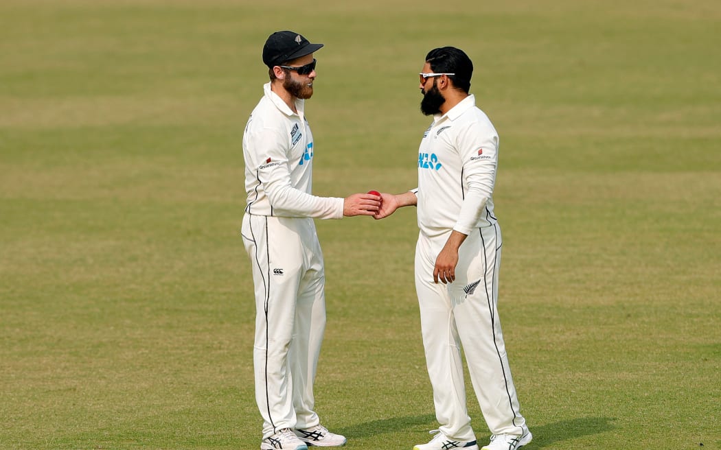 New Zealand captain Kane Williamson (L) and Ajaz Patel.