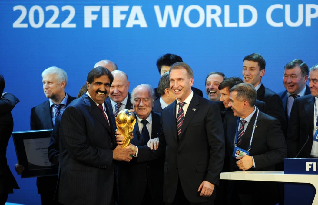 Sheikh Hamad bin Khalifa Al-Thani of Qatar, left, Fifa president Joseph Blatter and Russia's Deputy Prime Minister Igor Shuvalov celebrate the winning bids in 2010.