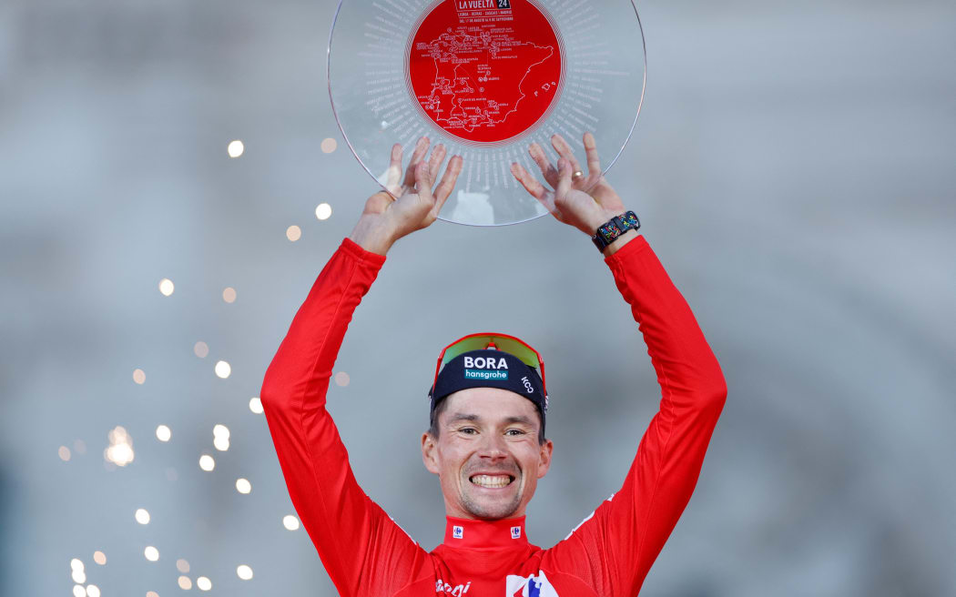 Team Bora's Primoz Roglic celebrates on the podium after the last stage of the Vuelta a Espana, 2024.