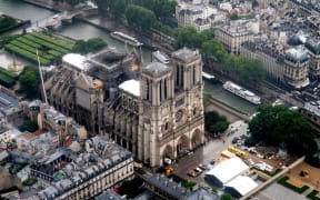 This aerial picture taken on June 12, 2019 in the French capital Paris shows the Notre Dame de Paris cathedral under repair after it was badly damaged by a huge fire on April 15.