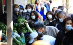 Shoppers shopping for food at a supermarket in Edogawa Ward, Tokyo on March 26, 2020, amid the Covid-19 outbreak.
