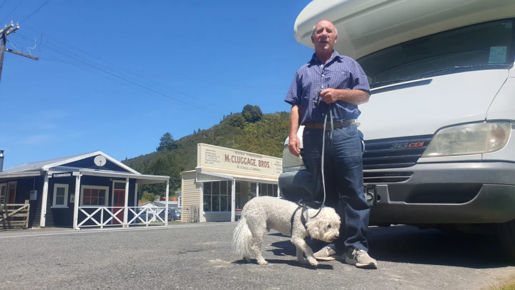 Motorhome owner Jim Salmon with Scooter.