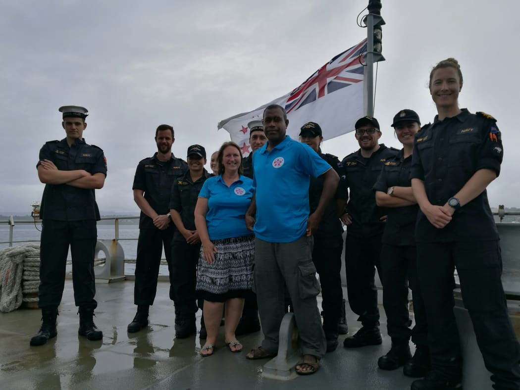 Lieutenant Commander Lorna Gray (right), the Commanding Officer of offshore patrol vessel HMNZS Otago, with crew members of Otago and representatives of Vanuatu charity Mamma’s Laef.