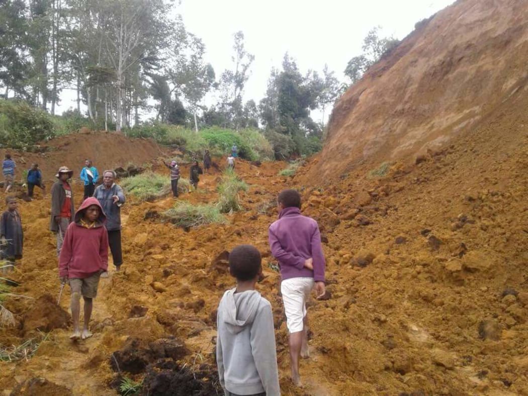 A landslide cutting of the road from Tambul to Mendi following a 7.5 earthquake.
