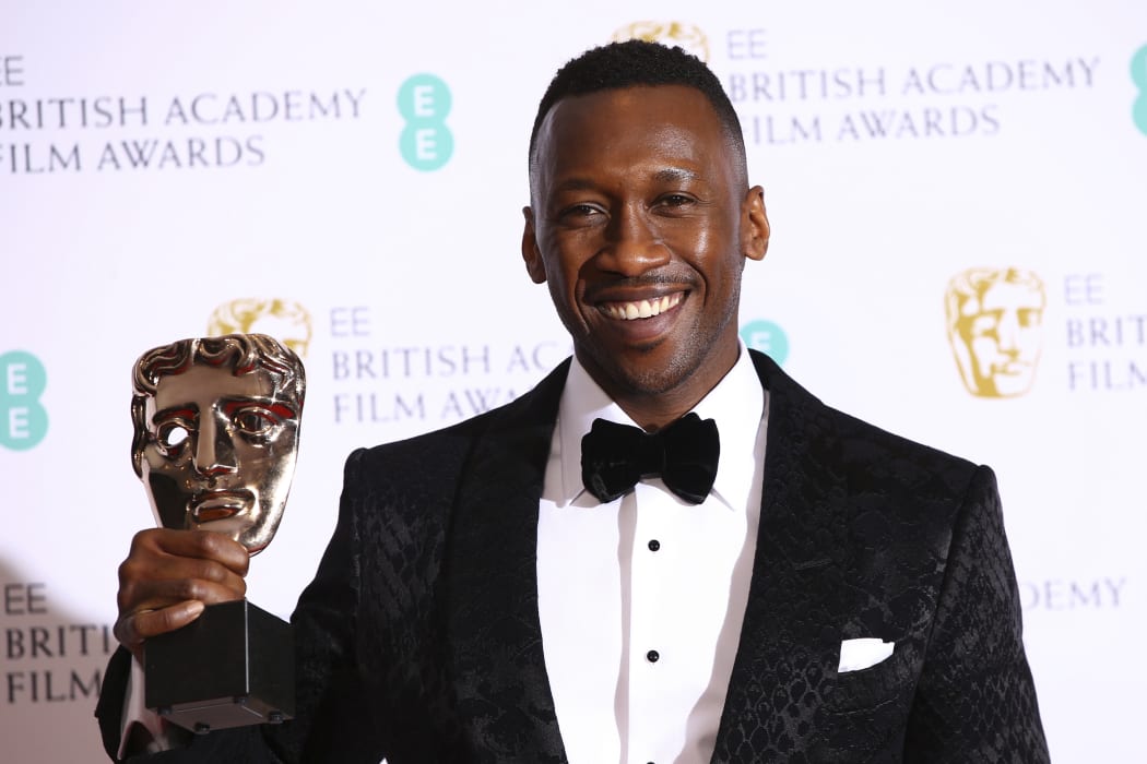 No Actor Mahershala Ali poses for photographers backstage with the Best Supporting Actor award for his role in the film Green Book.