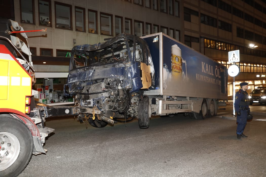 The stolen truck, which was driven through a crowd outside a department in Stockholm on April 7, 2017, is removed from the area.