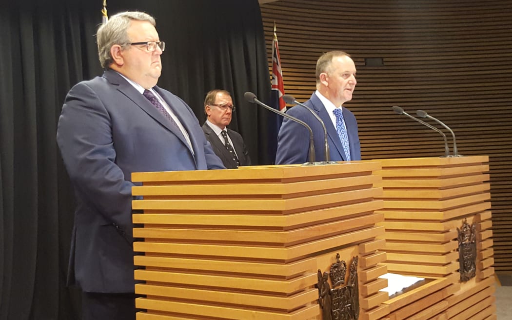 Prime Minister John Key announcing an extended deployment to Iraq with Defence Minister Gerry Brownlee and Foreign Minister Murray McCully.
