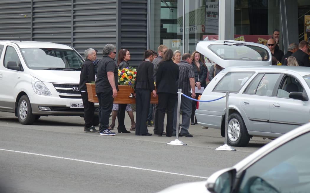 Peggy Noble's coffin is carried to the Ashburton Events Centre.