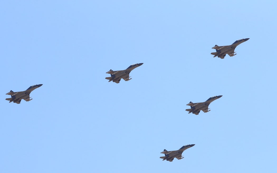 J-16 fighters flying during a military parade at Zhurihe training base in north China in 2017.