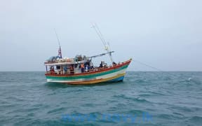 Sri Lanka Navy apprehends a local multiday fishing trawler with 38 individuals, suspected to be on an illegal migration attempt to a foreign country via sea, during a search operation carried out in southeastern seas of the island on 11 June, 2022.