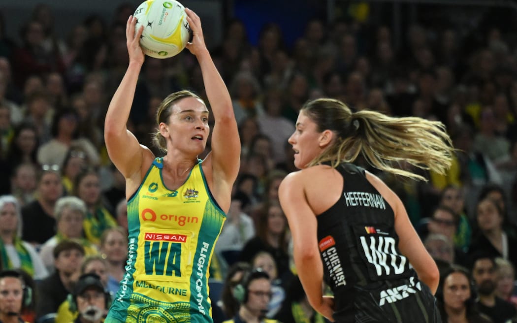 Liz Watson of Australia (left) in action during the first test match of the Constellation Cup series between the Australian Diamonds and the New Zealand Silver Ferns.