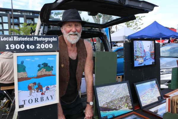 Martin Adlington at the Browns Bay Sunday market where he sells old photos.