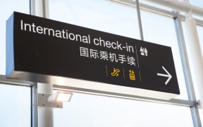 Signage for check-in at Auckland International Airport