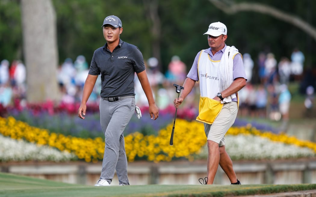 Danny Lee of New Zealand walks off the green on the 17th hole during THE PLAYERS Championship 2018.