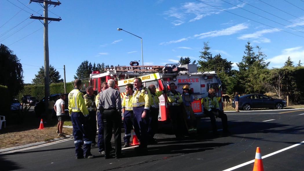 Firefighters take a break on Thursday.