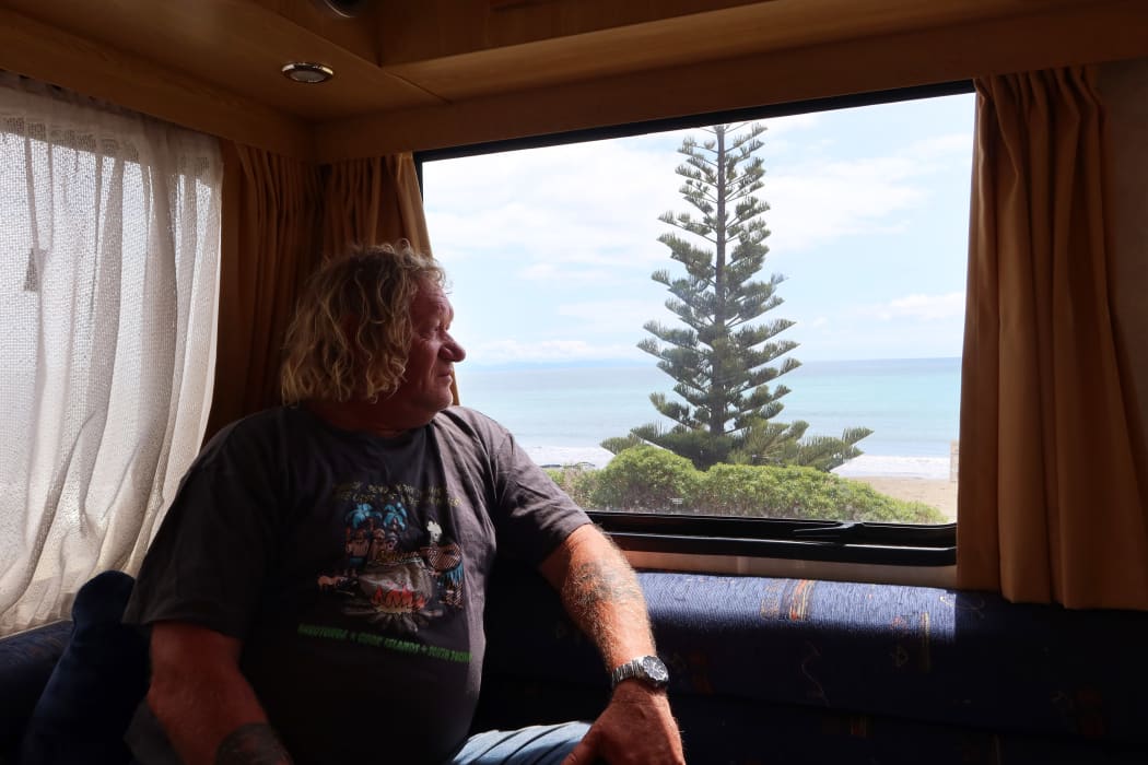 Mark Wills, who is organizing a petition against a proposed quad bike ban in Marlborough, looks out the window of his campervan at Marfells Beach.