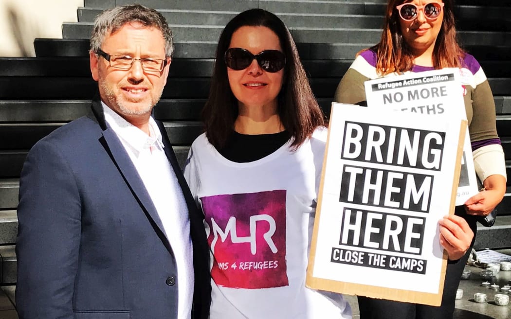 George Newhouse with refugee advocates at the Australian vigil for Hamed Shamshiripour.