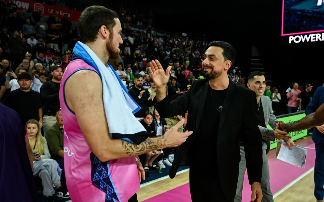 Tom Vodanovich of the Breakers and NZ Breakers coach Mody Moar celebrate the win.
