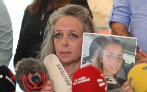 Keren Shem, the mother of French-Israeli woman Mia Shem held hostage by Hamas in Gaza, speaks to the press in Tel Aviv on October 17, 2023, amid the ongoing battles between Israel and the Palestinian group Hamas.