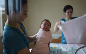 midwife and baby