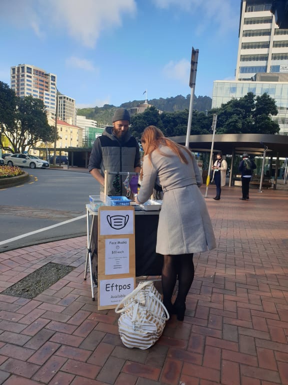 Cam, who's been selling masks made by his wife in Wellington.
