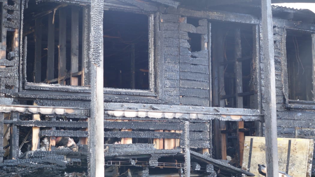 The flats - in an industrial area of Glendene, Auckland - were destroyed by the fire on Friday 25 September 2015.