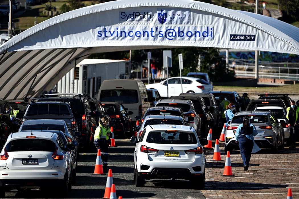 Health staff register residents at a Covid-19 coronavirus drive-through testing site on Bondi Beach in Sydney on 17 June 2021, after four positive cases.