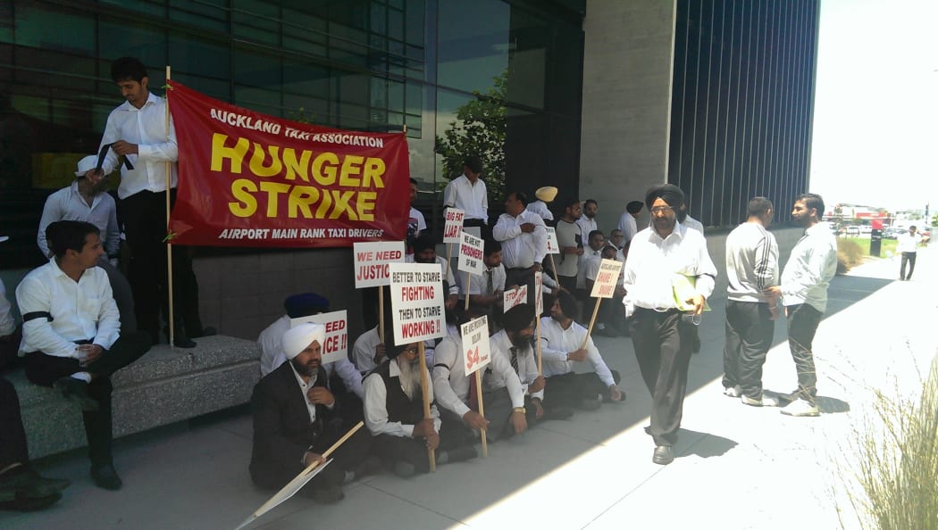 Taxi drivers protesting outside the airport's office on Monday.