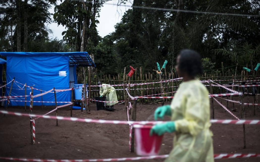 Health workers at an Ebola quarantine unit in Muma, after a one case of Ebola was confirmed in their village.