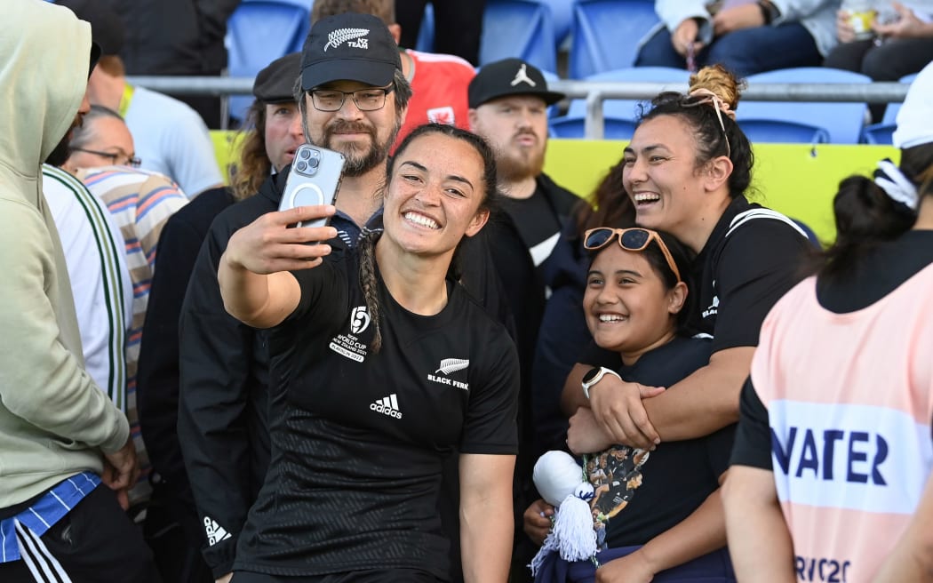 Theresa Fitzpatrick of New Zealand Black Ferns with fans after the match.